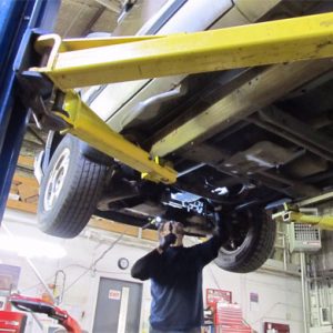mechanic working on transmission